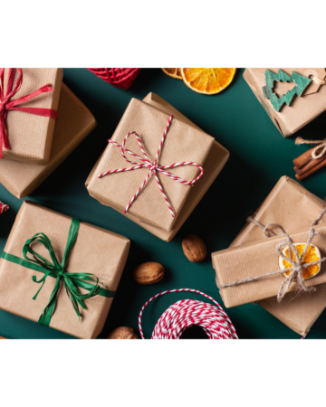 Image of presents wrapped in brown paper with red and green ribbon and a dark green background for Favorite Things Party blog post.