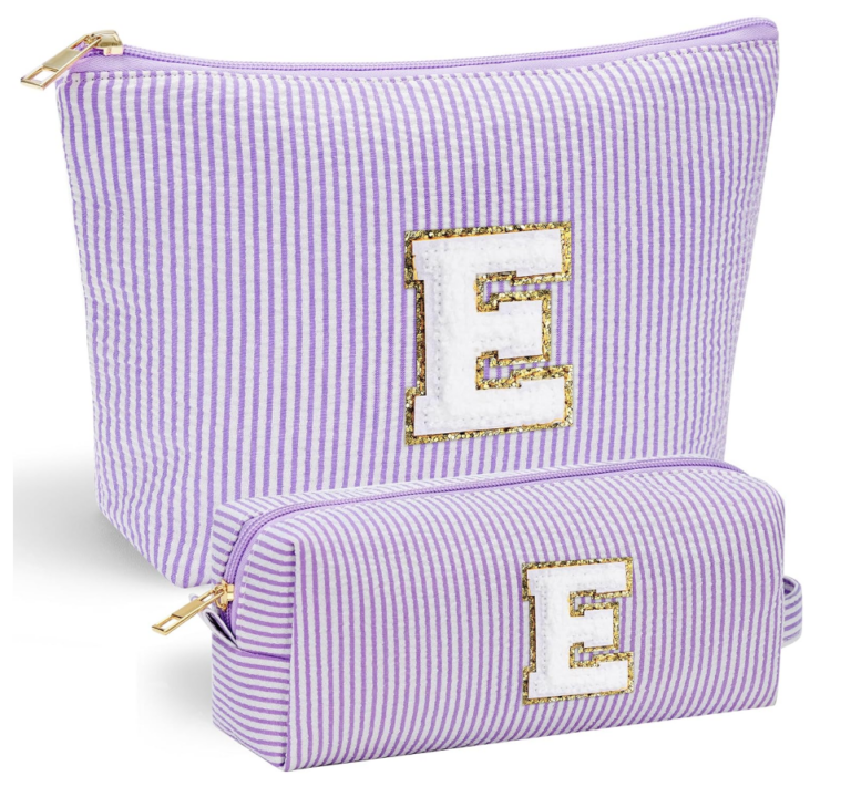 Image of two travel bags in purple and white stripe and initial "E".