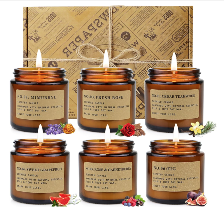 Image of set of 6 lit candles in amber jars and brown box behind them.