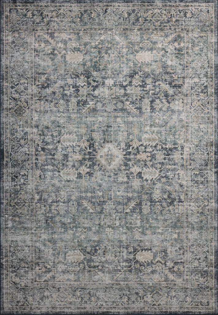 bedroom rug ideas. Vintage rug in blues, yellows, and pinks.