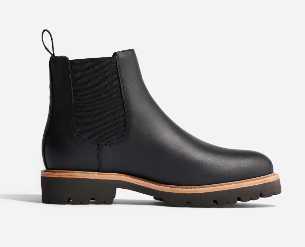 comfy teacher shoes. Image of black leather boot in lug style.