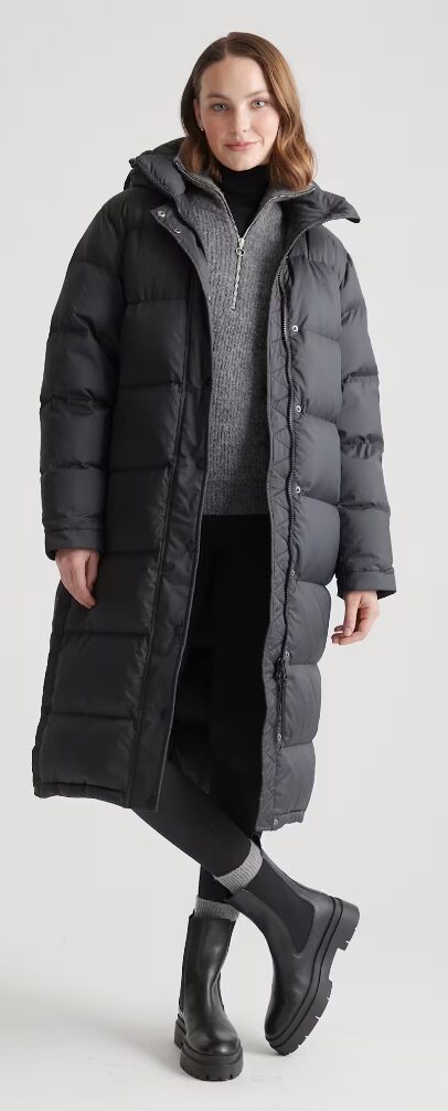 Christmas gifts for her. Image of woman in long black puffy coat
