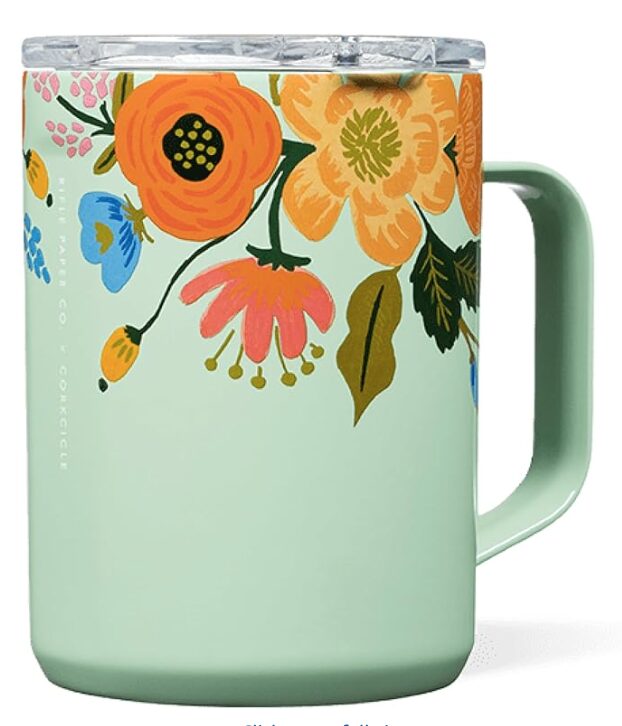 Christmas gifts for mom. Image of travel coffee mug with orange, yellow, pink, and blue flowers with mint green background and handle.