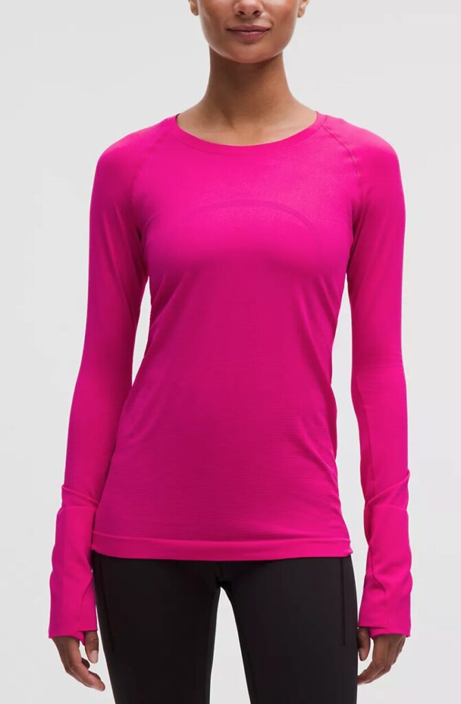 Christmas gifts she'll love. Image of woman in magenta long sleeve tshirtl