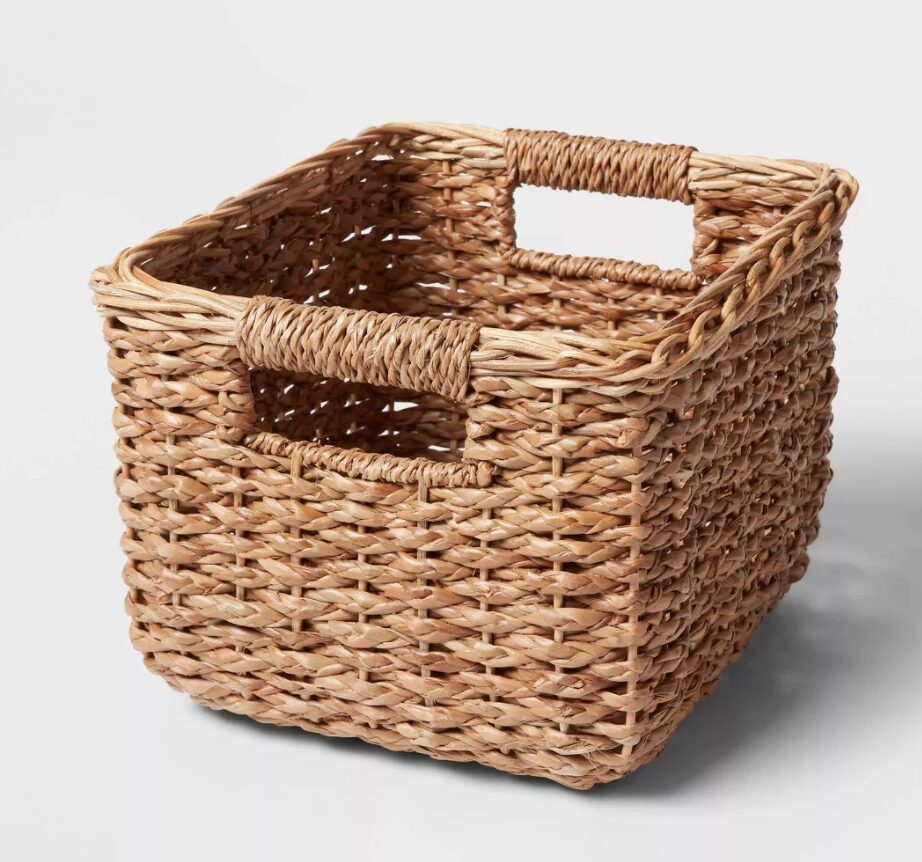 gift basket ideas. Image of a brown braided seagrass basket with handles.