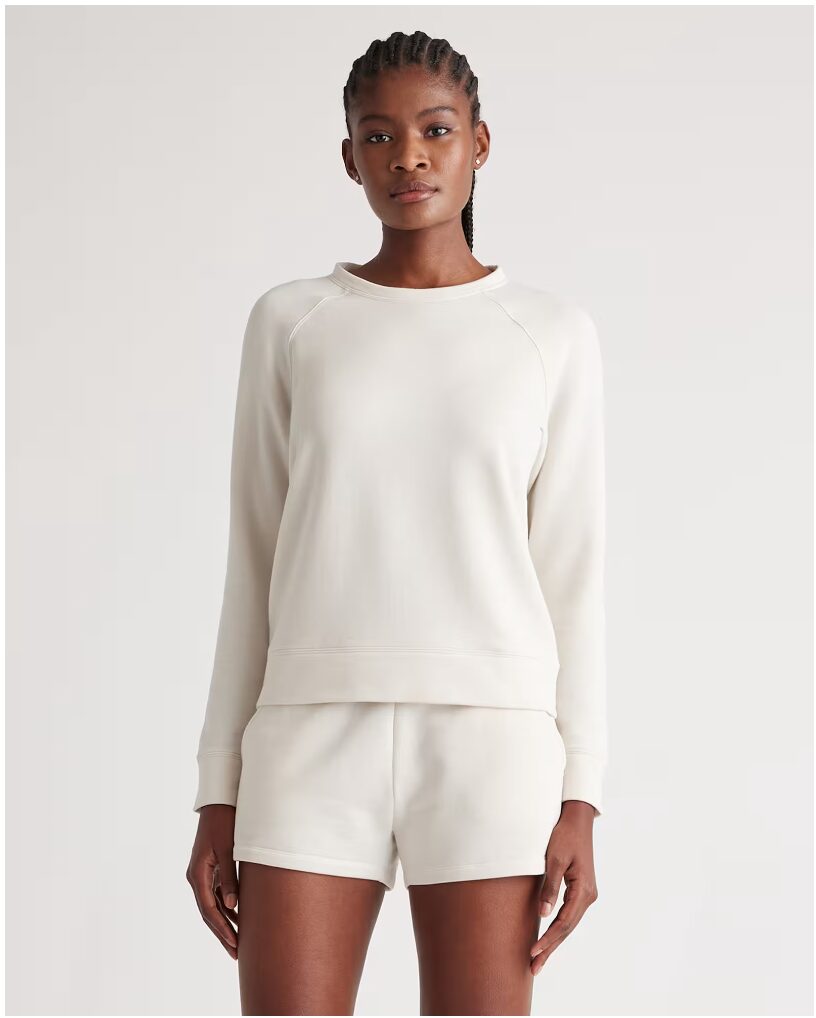 gift ideas for her. Image in woman in cream loungewear.