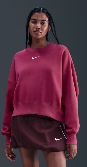 gift ideas clothes for women. Image of woman wearing Nike magenta sweatshirt.