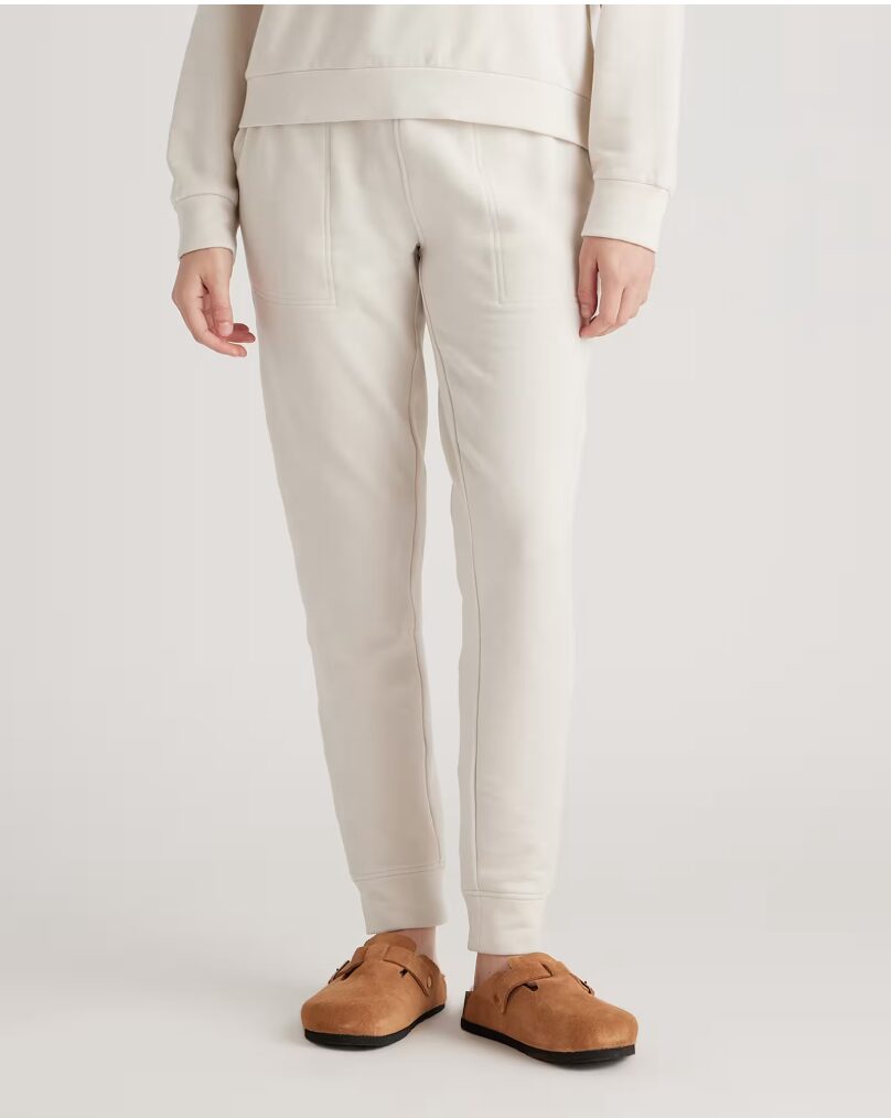 gift guide for her. Image in woman in cream loungewear.