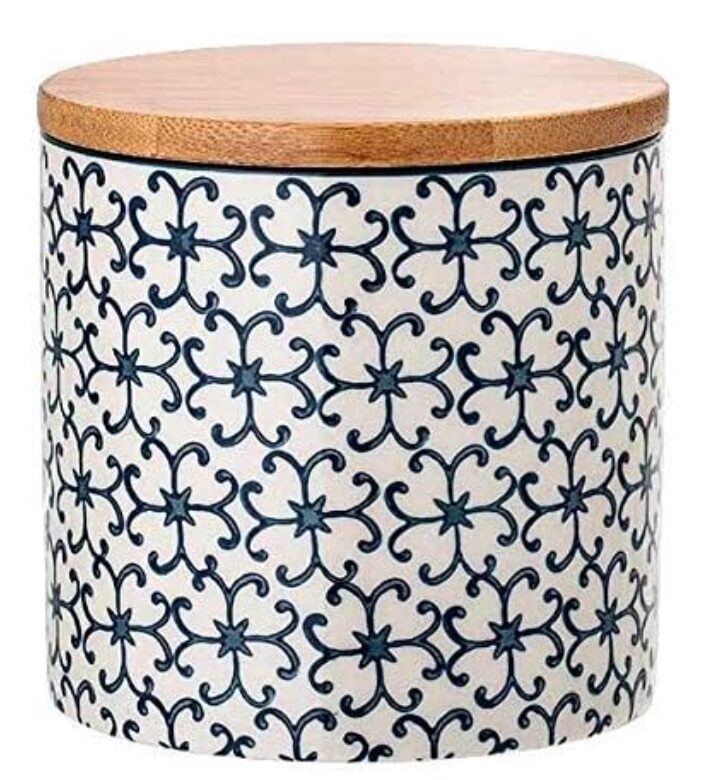 gifts for host that aren't wine. Image of ceramic jar with wooden lid. Pattern on the jar is a navy blue boho pattern and jar is white ceramic. 