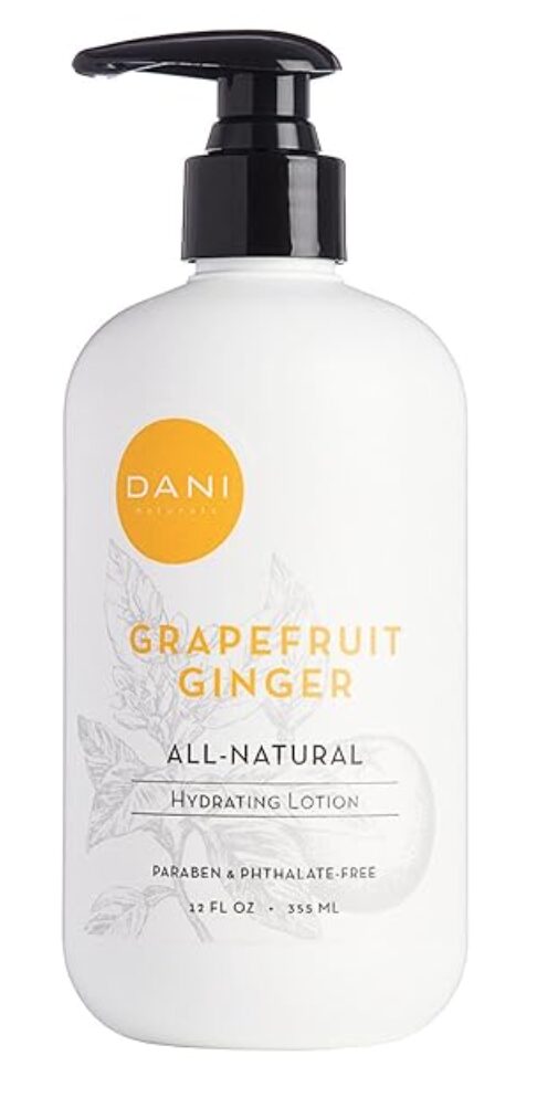 gift ideas for hostess. Image of DANI hand lotion with yellow label in a white bottle with black pump in grapefruit ginger scent. 