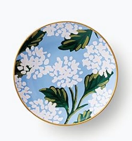 thoughtful gift for host. Image of ceramic ring dish that is blue and painted with white hydrangeas and green leaves. 