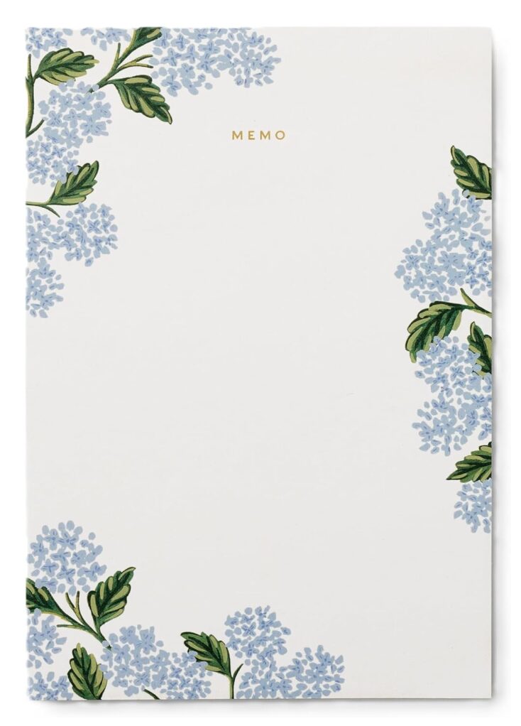 thoughtful gifts for hostess. Image of pad of paper that is white with blue hydrangeas around the border with green leaves and says "MEMO" in gold at the top. 
