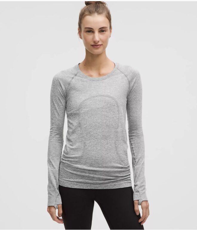 image of woman in grey swiftly tech long sleeve by Lululemon.