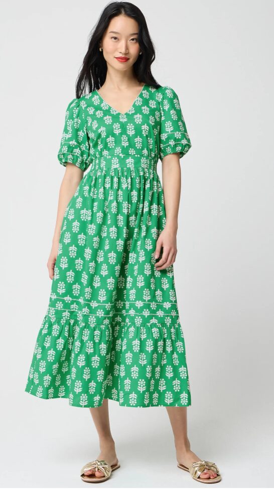 Woman in green Block-print puff-sleeve midi dress.
