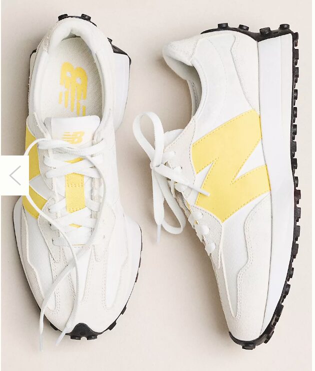 favorite things list. Image of white and yellow new balance 327 sneakers with black sole.