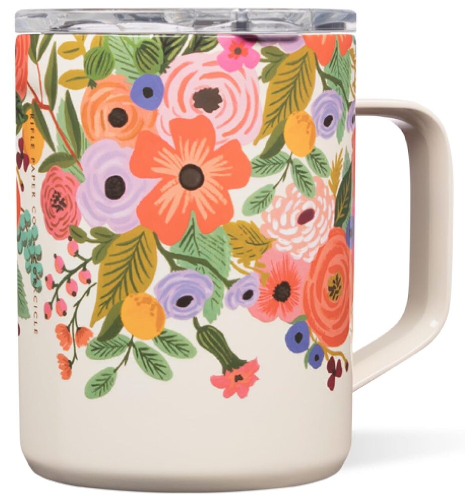 travel mug with handle, cream color with colorful flowers.