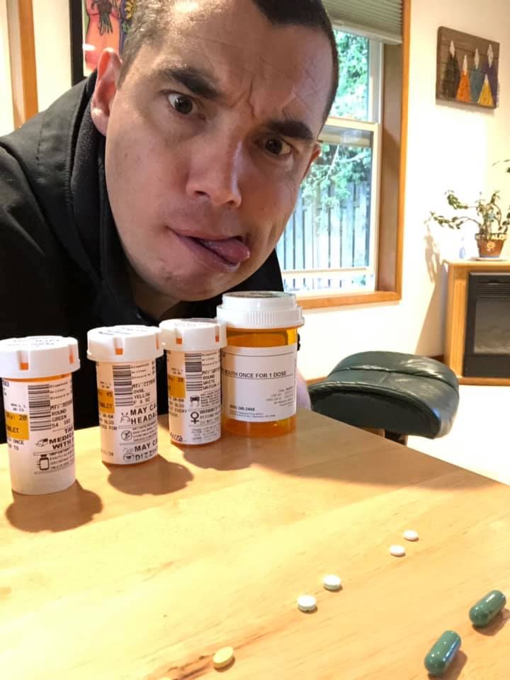 how to support friend whose husband died. Image of man making funny face in front of pill bottles. 