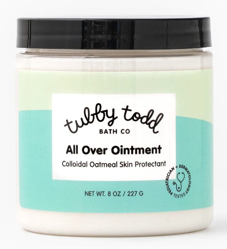 Image of tubby todd's all over ointment in container with green and teal label. 