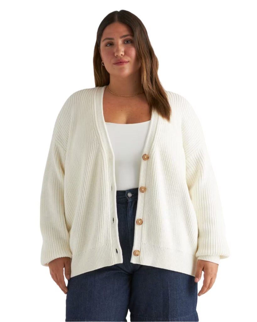 cute teacher outfit ideas image of woman wearing oversized organic cotton ivory cardigan with white shirt and jeans.