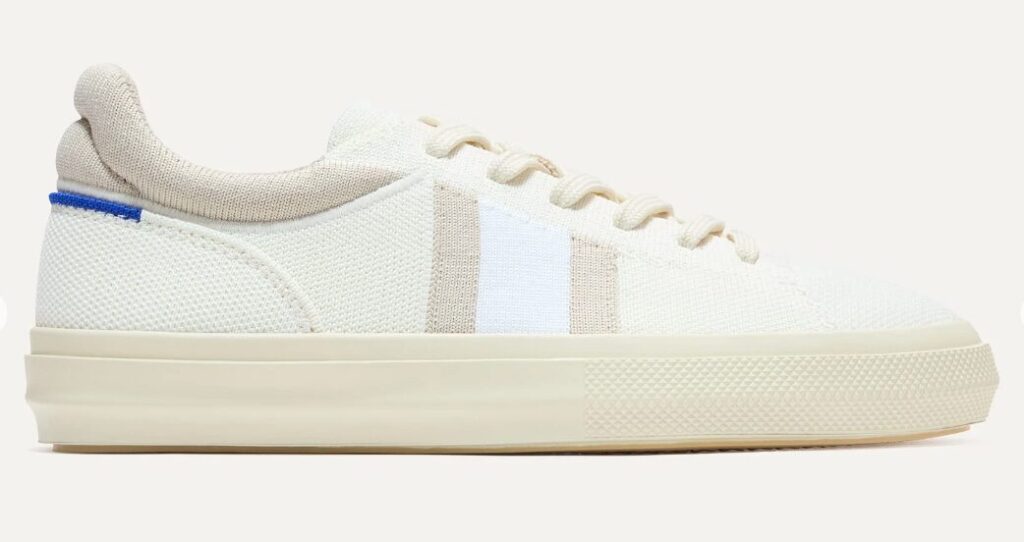 teacher outfits shoes image of cream Rothy's tennis shoes with brown and white stripe.